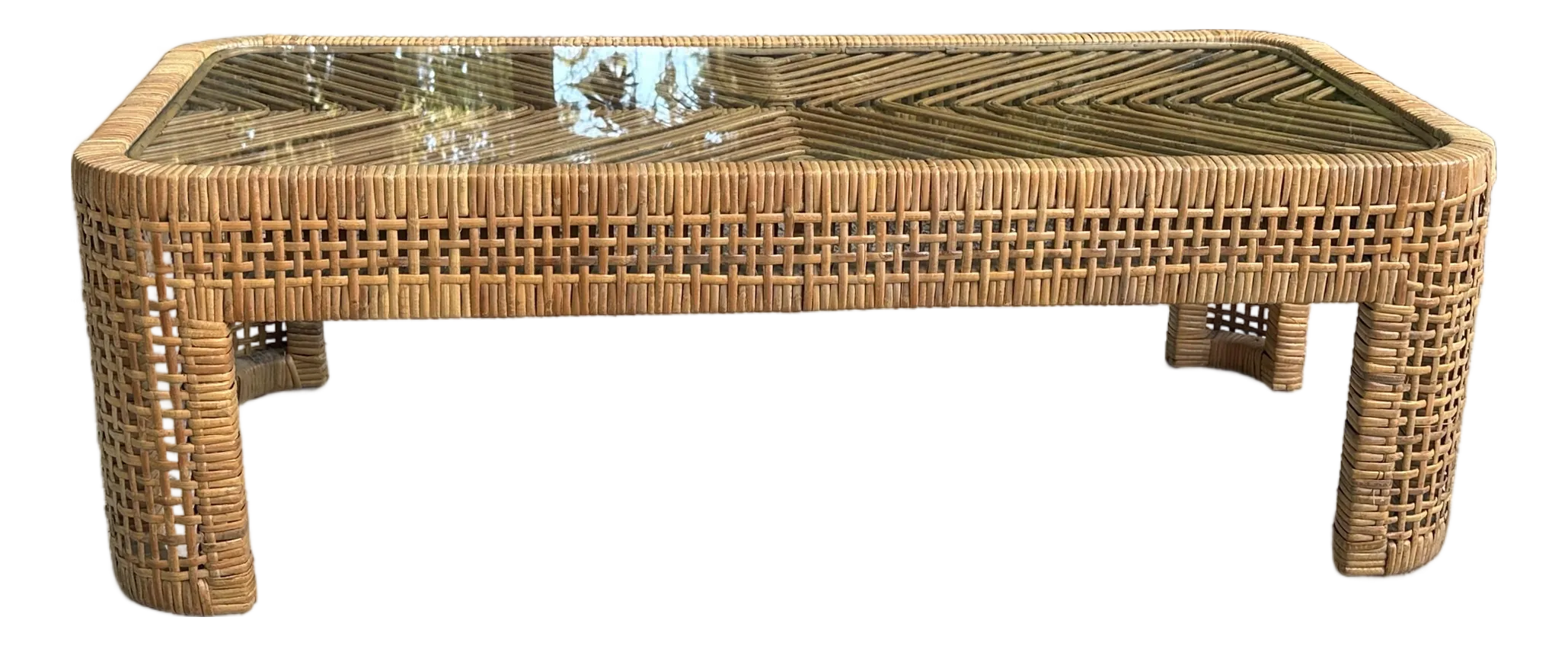 Woven Rattan Coffee Table With Glass Top Over Chevron Pattern