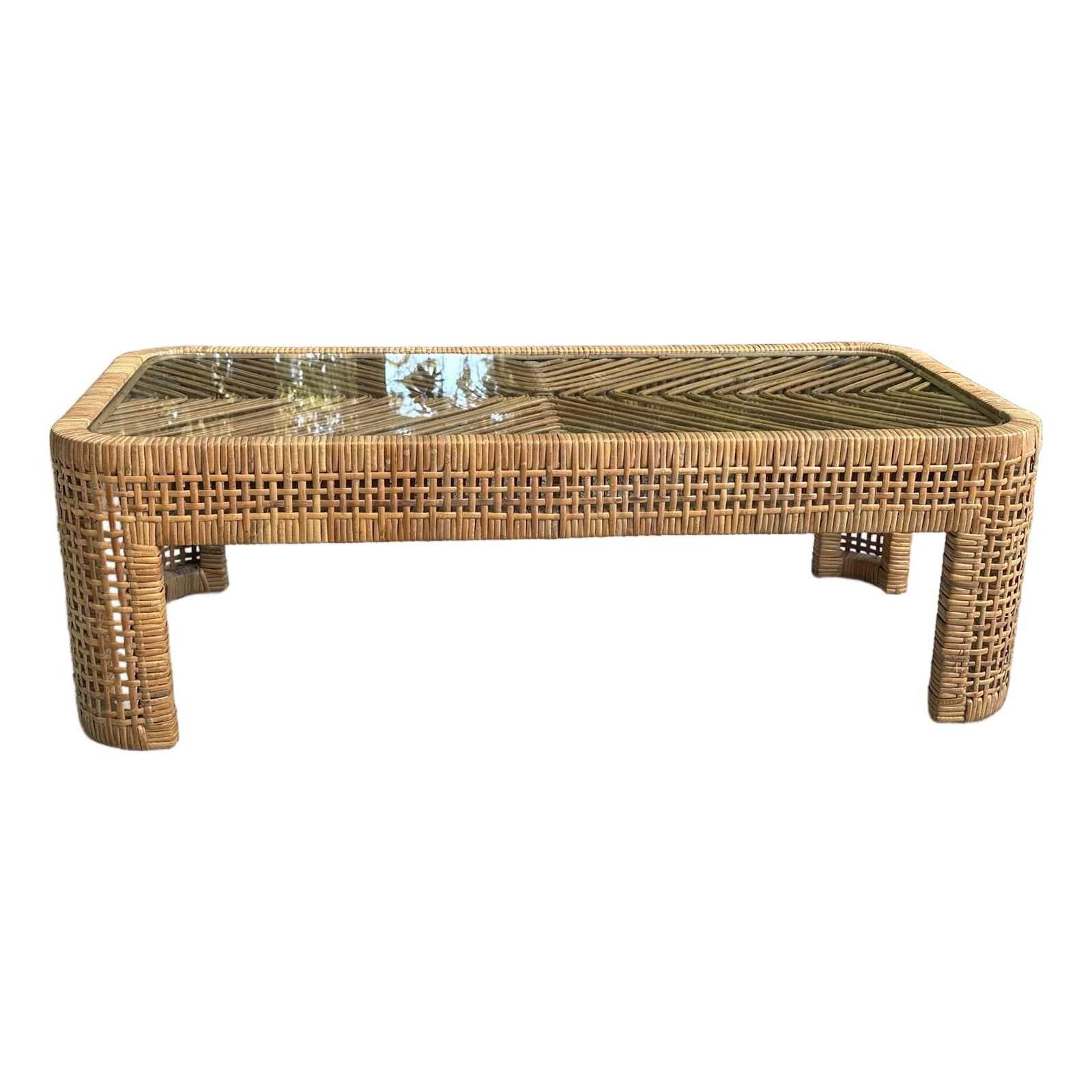 Woven Rattan Coffee Table With Glass Top Over Chevron Pattern