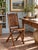 An antique wooden folding chair featuring a paneled back, arched crest rail, and warm brown finish. The folding frame is...