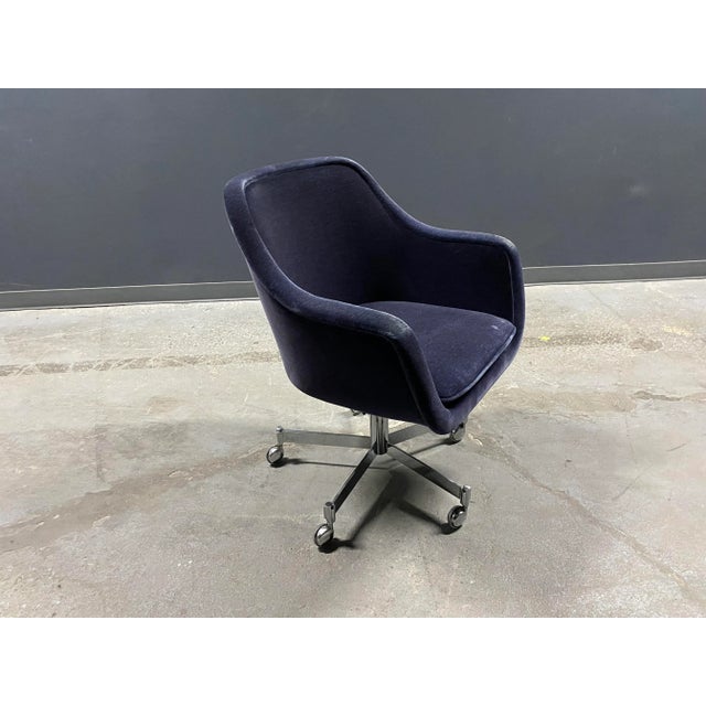 Ward Bennett office chairs in original navy blue mohair over stainless steel bases.