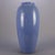 Pair of Arts & Crafts McCoy School art pottery floor vases feature collar with embossed swags and bows and periwinkle blue...