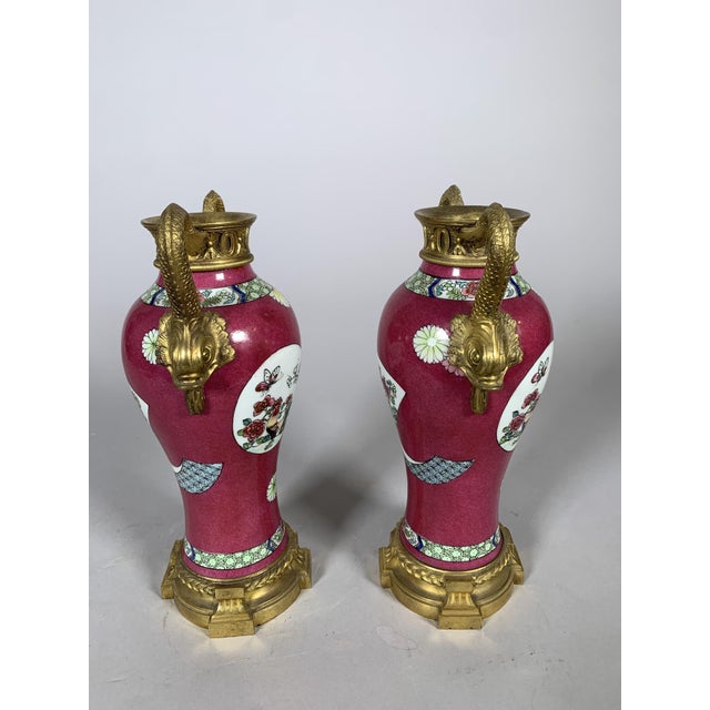 Pair of Qianlong period Chinese porcelain vases 18th century Brought to France in the 18th century These vases were...