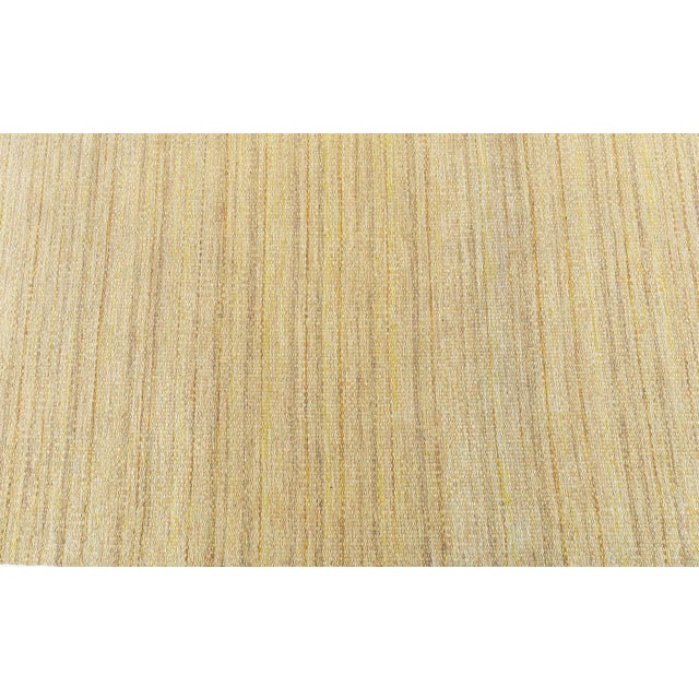 This vintage Swedish flat-woven rug is a beautiful example of Scandinavian minimalism, where understated design meets...