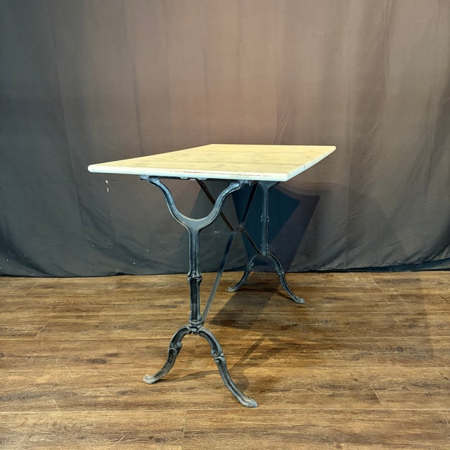 Classic and versatile French marble top gray cafe table or writing desk with a classic Provincial iron base. Marble is a...