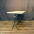 Classic and versatile French marble top gray cafe table or writing desk with a classic Provincial iron base. Marble is a...