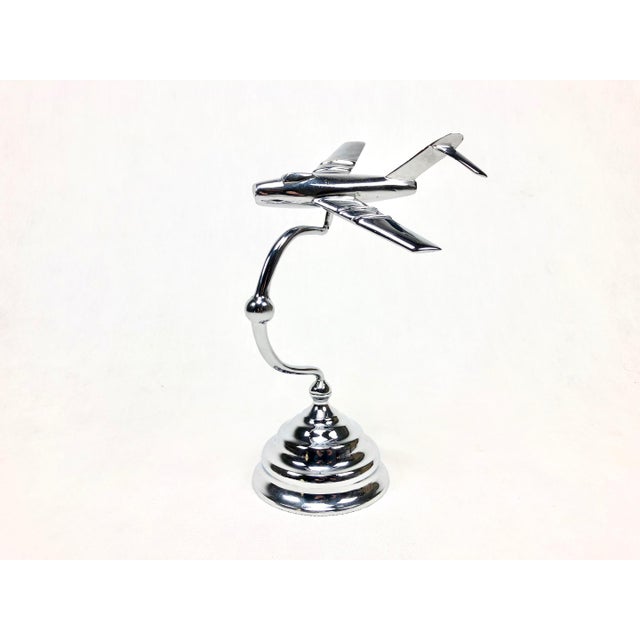 An intricately made statuette of the Mig15 LIM plane, from the 1950s. All brass covered with chrome. It consists of three...