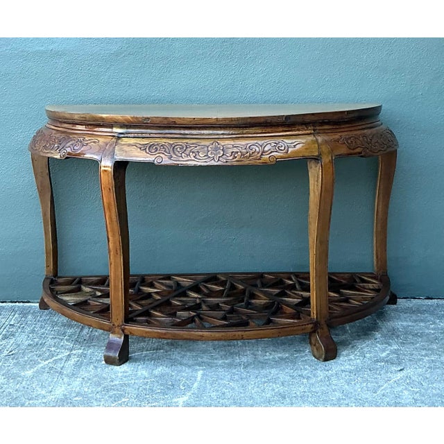 Masterfully blending Eastern traditional form with mid-century versatility, this pair of vintage Chinoiserie demilune...