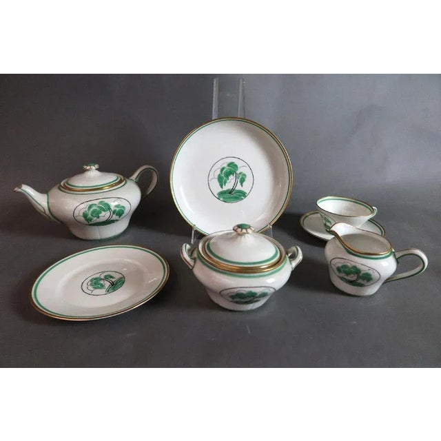 "Rouard Art Deco Porcelain Tea and Dessert Set in Paris" Art Deco porcelain tea and dessert set with palm tree decoration...