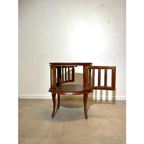 This charming vintage wooden display cabinet combines elegance with functionality. Crafted from solid wood, it features...