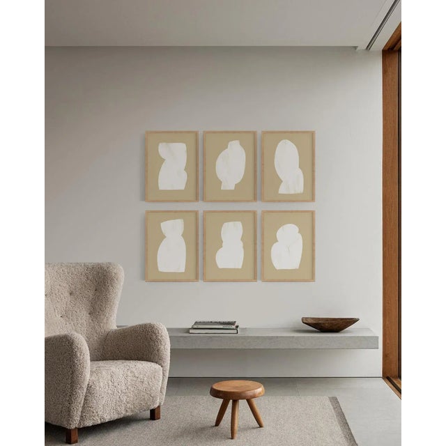 Framed set of 6 geometric forms 12"x16" size open edition giclee prints. Elegant white figures on beige background. Six...