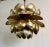 Single large brass pendant light in the shape of an open lotus flower by Feldman. Petals feature an etched design. More...