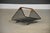A mid century modern iron mesh with rush wrapped handle magazine rack or log holder designed by Tony Paul. Minor oxidation...