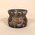 A striking signed studio pottery vase featuring a compact, sculptural form with a softly cinched waist and flared rim. The...