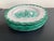 A set of 4 hand made Italian pottery plates in a greenish turquoise on a lightly glazed background of white. The borders...