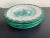 A set of 4 hand made and decorated Italian pottery plates in a greenish turquoise on a lightly glazed background of white....