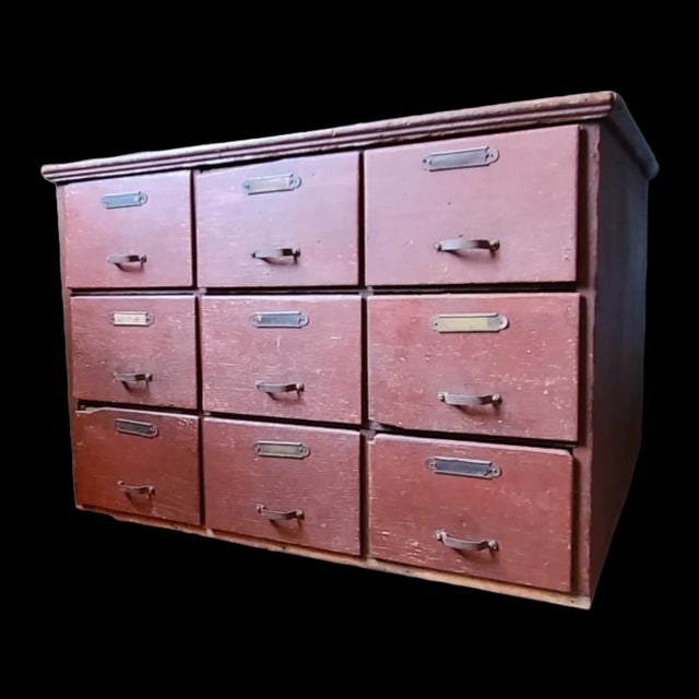Antique fittings cabinet from a late 19th century hardware store. In original red paint, retaining the original pulls,...