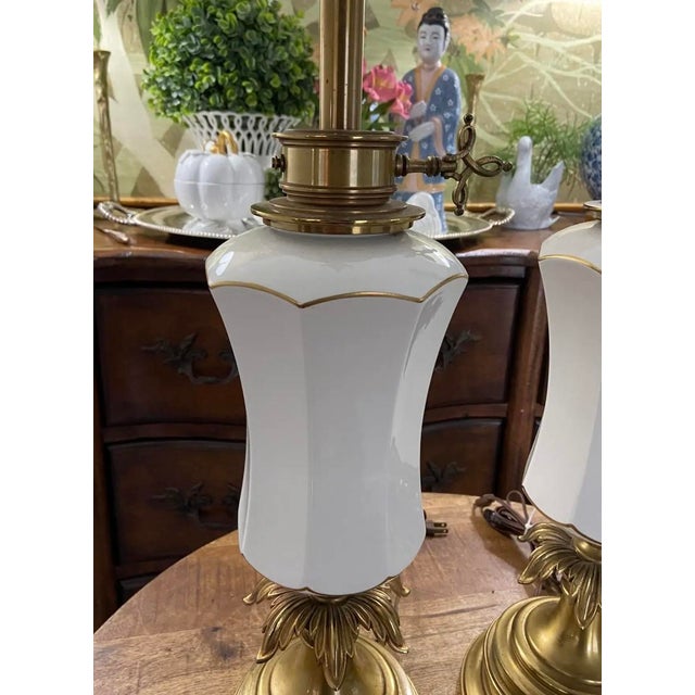 Absolutely lovely pair of vintage Stiffel brass and ceramic tall lamps with decorative key-turn and ornate plume-style...