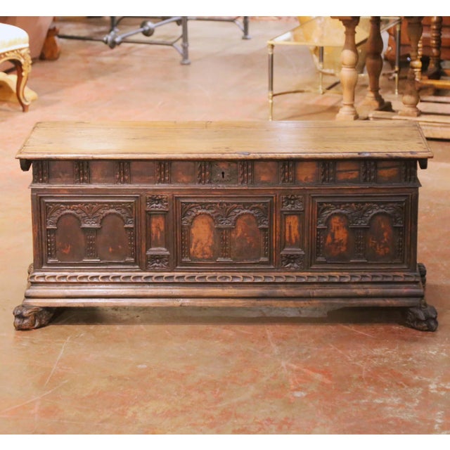 Crafted in Italy circa 1750, this impressive antique walnut cassone offers both architectural presence and practical...
