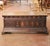 Crafted in Italy circa 1750, this impressive antique walnut cassone offers both architectural presence and practical...