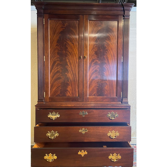 Bill Deblay designed the Stickley Williamsburg 18th-century armoire, which features one-piece flame mahogany for each door...