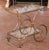 This elegant vintage French bar cart, crafted circa 1950, showcases refined mid-century design in a warm gilt-brass...