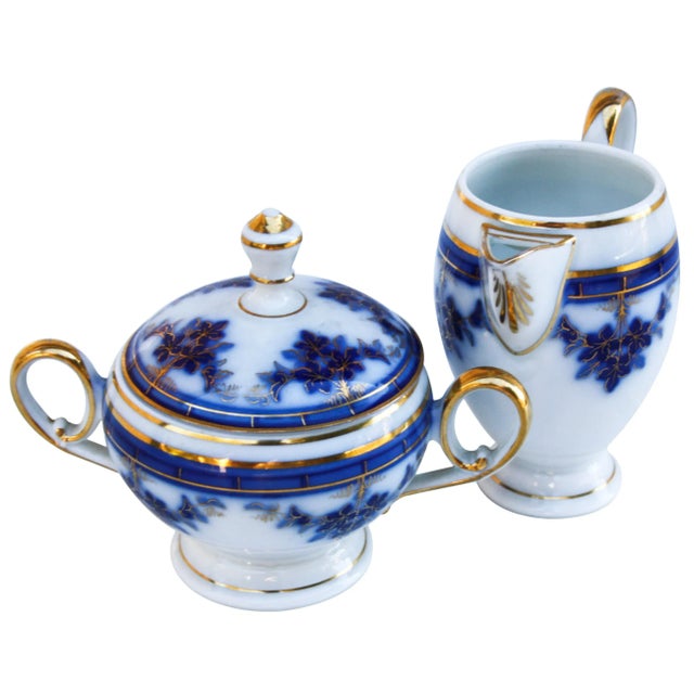 Antique Carlsbad creamer and sugar dish with intricate hand-painted blue pattern and gold embellishment. Creamer, 4.25"L x...