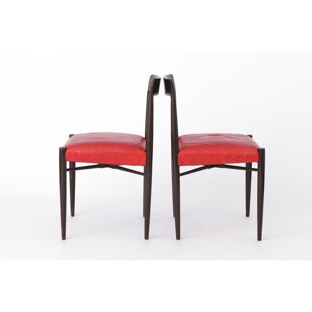 Pair of wooden vintage chairs. Unknown manufacturer. Most likely German origin. Production period: approx. 1960s. Sturdy...