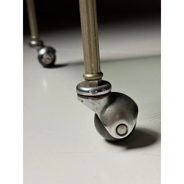 Serving trolley, France, 1960. Frame in faux bamboo motif. with two glass shelves. In good condition, with only minor...