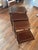 Complete nest of four graduated wood occasional tables with contrasting line inlay. The largest top has a central oval fan...