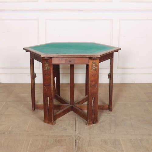 Late 19th Century Arts and Crafts octagonal games table with a green felt top. This table has decorated legs with carved...