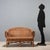1950s-60s sofa featuring a wicker and bamboo frame that evokes the natural and cozy style of the era. The artisanal wicker...
