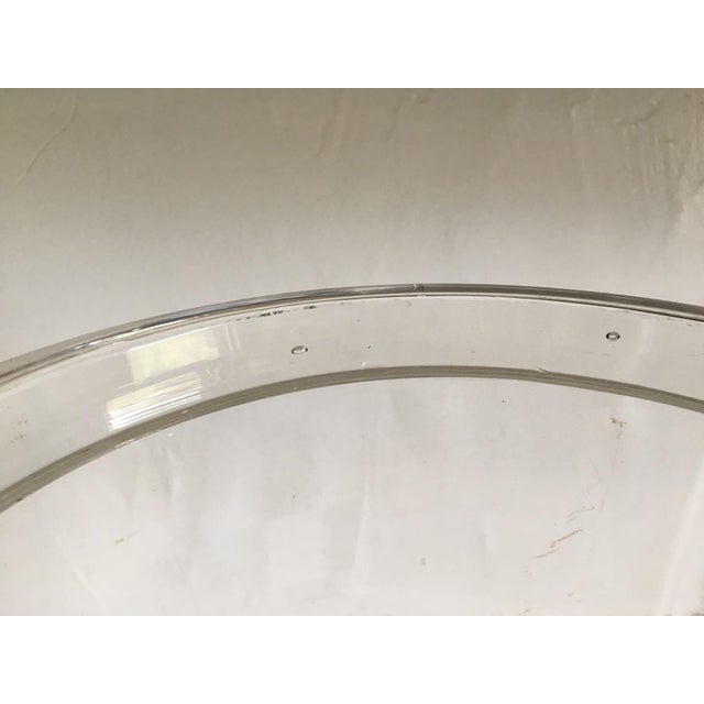 This has the irregular bubbles and wavy glass imperfections of chunky handmade glass. It might be pressed glass. I bought...