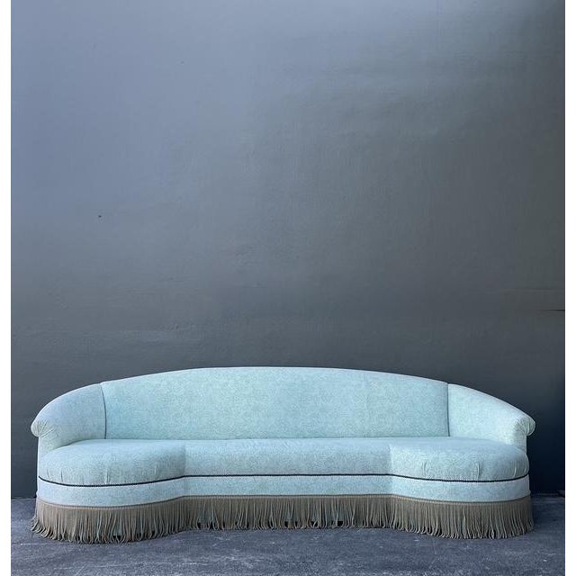 This magnificent extra-long curved sofa is a masterpiece of Regency-inspired design, perfect for those seeking a statement...