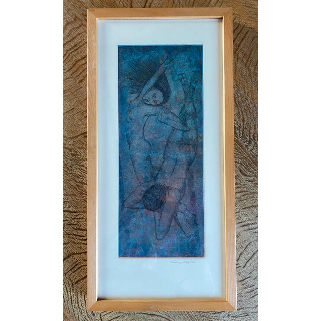 Beautifully rendered etching depicting a pair of swimming figures, presented in a blonde hardwood frame under glass. The...