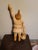 This product is a vintage hand-carved wooden statue of Santa Claus in a folk art style. The statue features intricate...