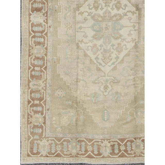 Mid 20th Century Mid 20th Century Turkish Vintage Oushak Medallion Rug With Muted Colors in Earth Tones For Sale - Image 4 of 11