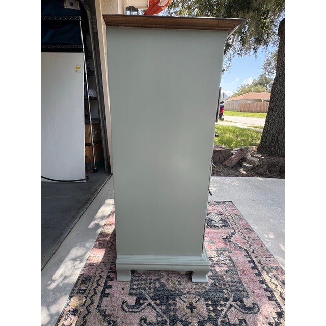 Fully refinished by hand: Body in a soft sage green (Evergreen Fog) Rich walnut-stained wood top for contrast New antique...