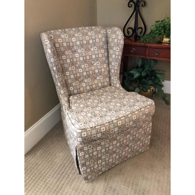 Sweet petite wingback chair. Perfect for a bedroom accent chair. The chair has been in the family but it is unknown...