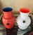 Carlo Moretti set of two cased vases signed. Murano Italy. Red/blue and ivory/orange. H 5" x D 3" and H 5" x D 3.5"...