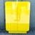 A striking Postmodern waterfall cabinet, finished in radiant high-gloss yellow laminate with bold rounded edges and a...