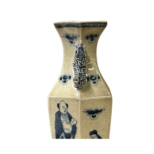 This vintage porcelain vase showcases a unique geometric, multi-faceted rhombus silhouette with a crackle-glazed off-white...
