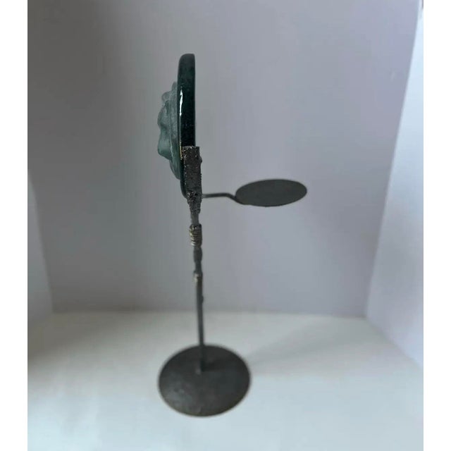 A striking Brutalist-style sculptural object featuring a cast art glass fox set within a hand-welded metal stand. The...