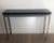 This beautiful and elegant console table is in Chromed with a thick black lacquered top. This is a French work. Circa 1970