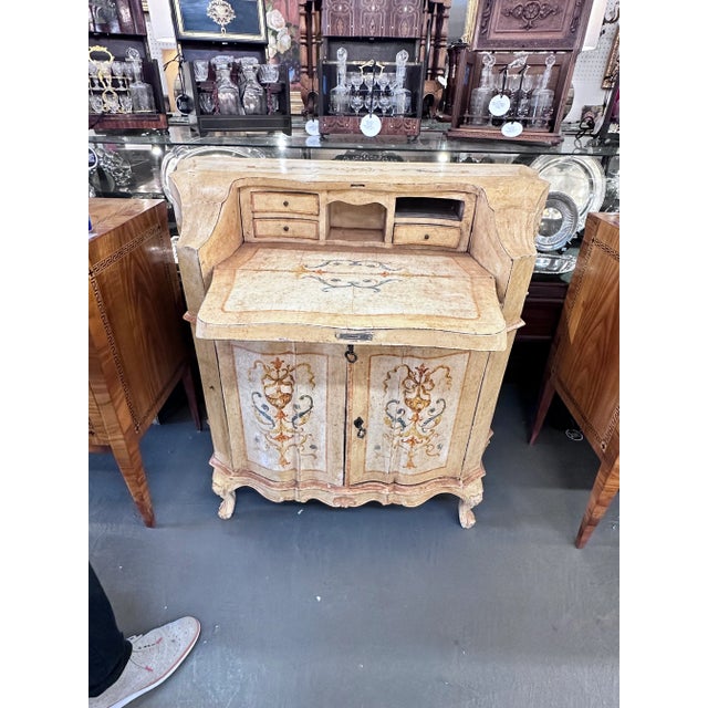 19th C. Italian Venetian hand painted desk. Shaped serpentine front consisting of a drop front writing surface over two...