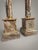 Bring classic sophistication to your home with this striking pair of neoclassical-style veined marble columns. Crafted...