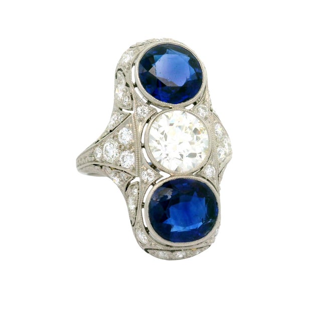 A captivating original Art Deco navette ring featuring 5.00 carats of two oval blue sapphires. The deep blue hue of the...