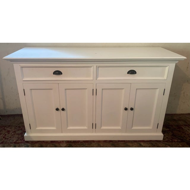 Craftsman style sideboard cabinet with antique brass drawer pulls Purchased from Environment on Melrose Avenue in Los...