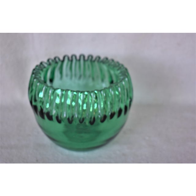 Vintage handcrafted glass ribbon edge green bowl. This is a pre-owned item so please see all pictures and ask any questions.