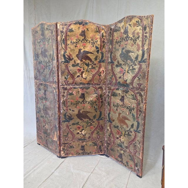An absolutely stunning antique late 18th century or early 19th century gilded and painted embossed leather folding screen...