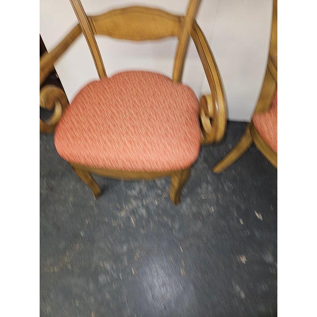 Beautifully hand painted and pinstriped Armchairs, a mustard color with Floral decoration on the crestrail. An Exuberant...
